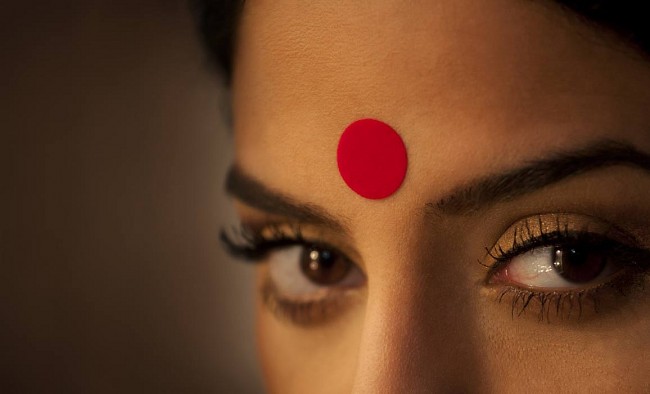 mysteries behind the red dot bindi on indian womens forehead