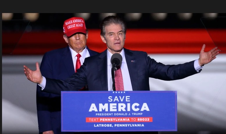 Former US President Donald Trump (L) looks on as Republican Senatorial candidate Mehmet Oz speaks during a “Save America” rally ahead of the midterm elections at Arnold Palmer Regional Airport in Latrobe, Pennsylvania, on November 5, 2022.