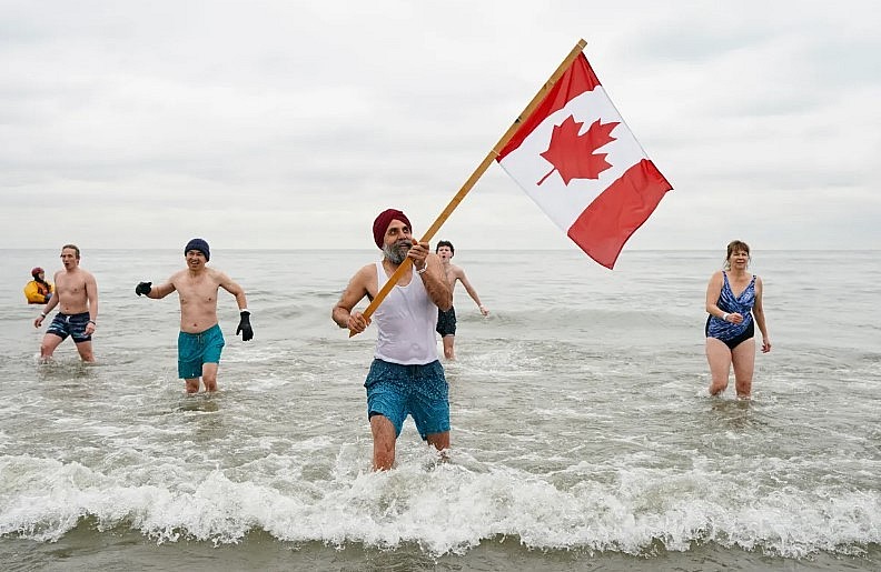 People participate in the annual New Years Day Polar Bear Dip in Oakville