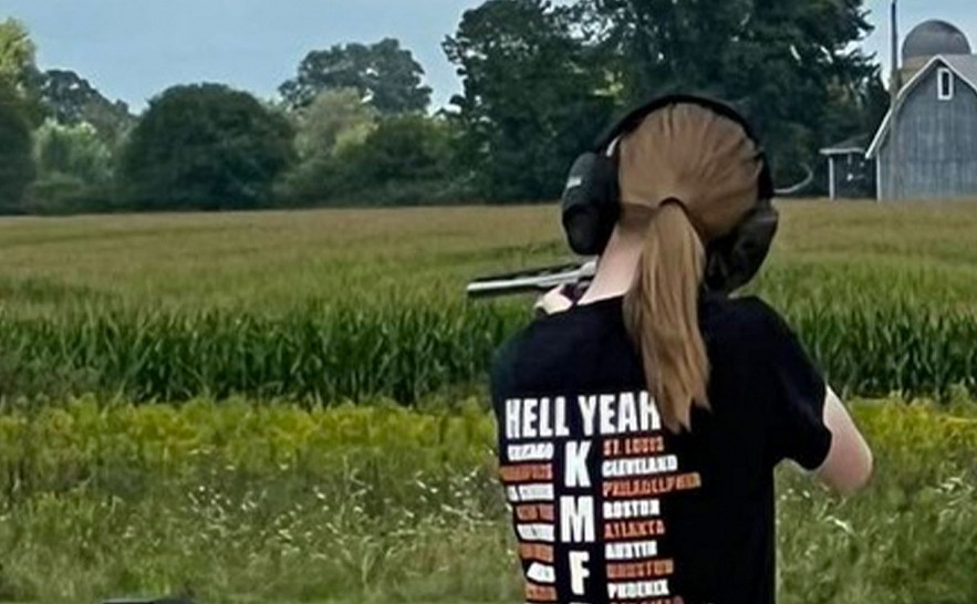 In a terrifying picture, the teenage girl who killed two people and injured six others in a school shooting is seen honing her shot at a shooting range while sporting a T-shirt connected to the Columbine murderers.