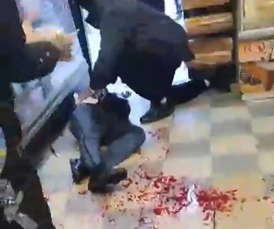 Screen grab shows the 36-year-old mailman lying on the floor at Joe’s Grocery on Lenox Road