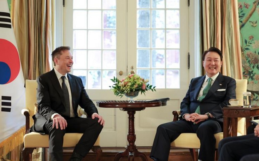 President Yoon Suk Yeol and Tesla CEO Elon Musk laugh during their meeting in Washington in this April 2023