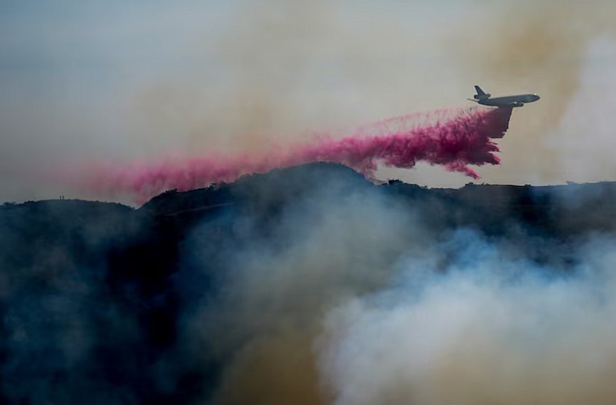 Retardant is dropped by air tanker on the Palisades Fire in the outskirts of the Pacific Palisades neighborhood of Los Angeles, Jan. 10, 2025