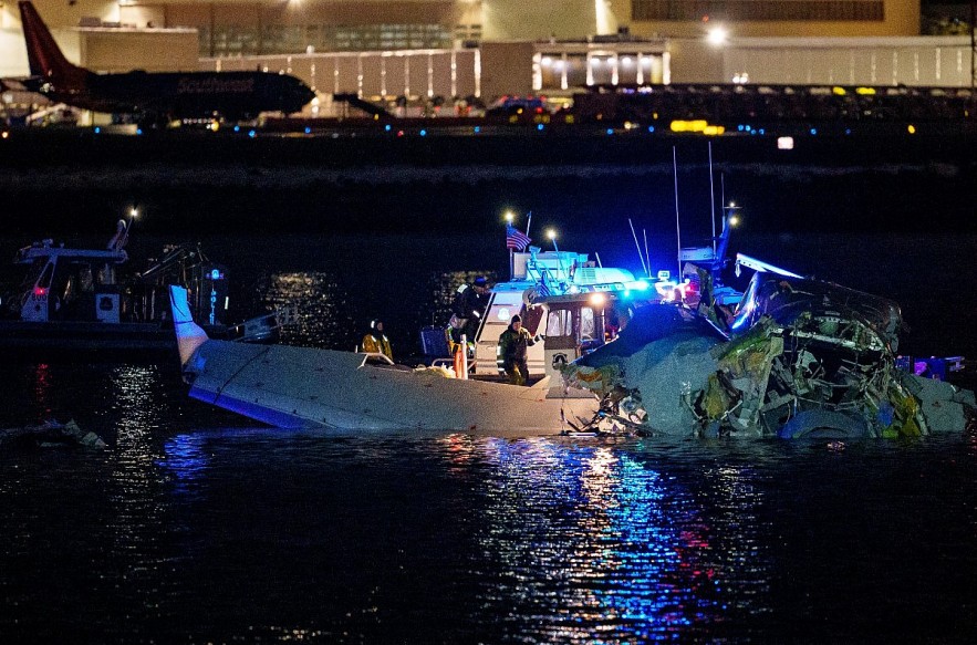 Search efforts near airplane wreckage in the Potomac River