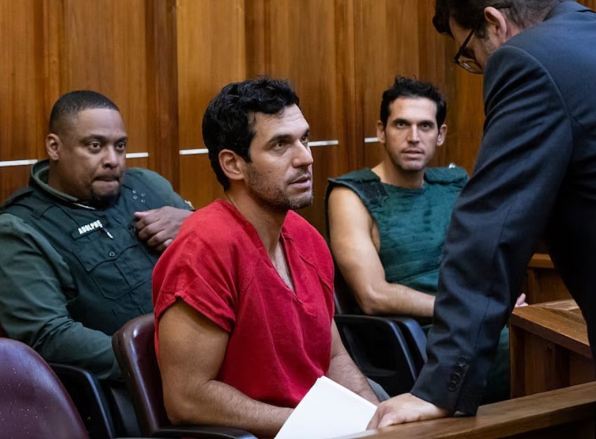 Oren Alexander, 37, center, and his twin brother, Alon, center-right, speak to their attorney Joel Denaro during their bond hearing at the Richard E. Gerstein Justice Building on Dec. 13, 2024 in Miami.