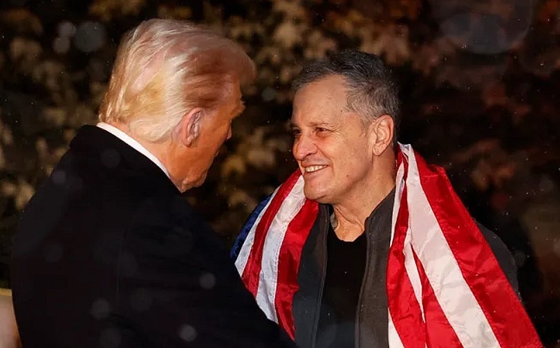 US President Donald Trump greets former detainee Marc Fogel as he arrives at the White House in Washington, DC, on February 11, 2025