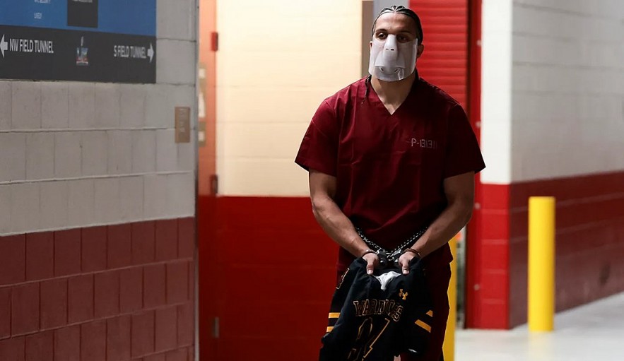 Mack Hollins (13) of the New England Patriots in a mask and handcuffs ahead of Super Bowl LX against the Seattle Seahawks at Levi's Stadium on Feb. 8, 2026 in Santa Clara, California