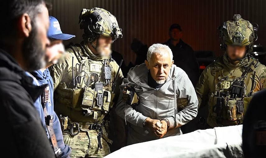 Zubayar Al-Bakoush is transferred to a stretcher by FBI agents after arriving in the United States. (Supplied: FBI)