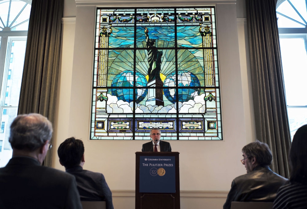 Mike Pride, administrator of The Pulitzer Prizes, announces the 2016 Pulitzer Prize winners at Columbia University in New York on April 18, 2016.  Photo AFP