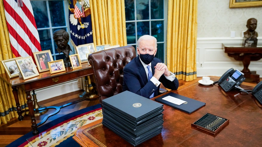 Joe Biden at his desk in the Oval Office of the White House. Earlier in the day he was sworn In as 46th President of the United States on January 20, 2021, in Washington, DC.