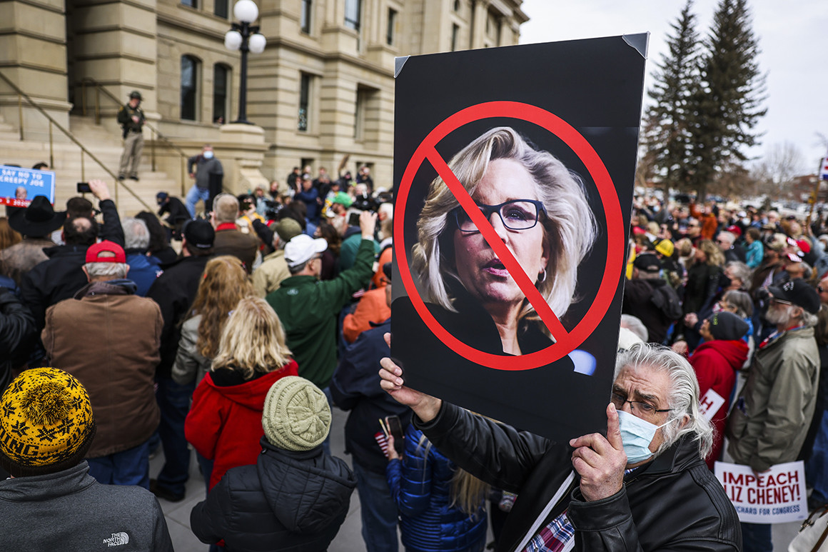  A man holds up a sign against Rep. Liz Cheney (R-WY) as Rep. Matt Gaetz (R-FL) speaks to a crowd during a rally against her on January 28, 2021 in Cheyenne, Wyoming. Gaetz added his voice to a growing effort to vote Cheney out of office after she voted in favor of impeaching Donald Trump. (Photo by Michael Ciaglo/Getty Images) | Michael Ciaglo/Getty Images