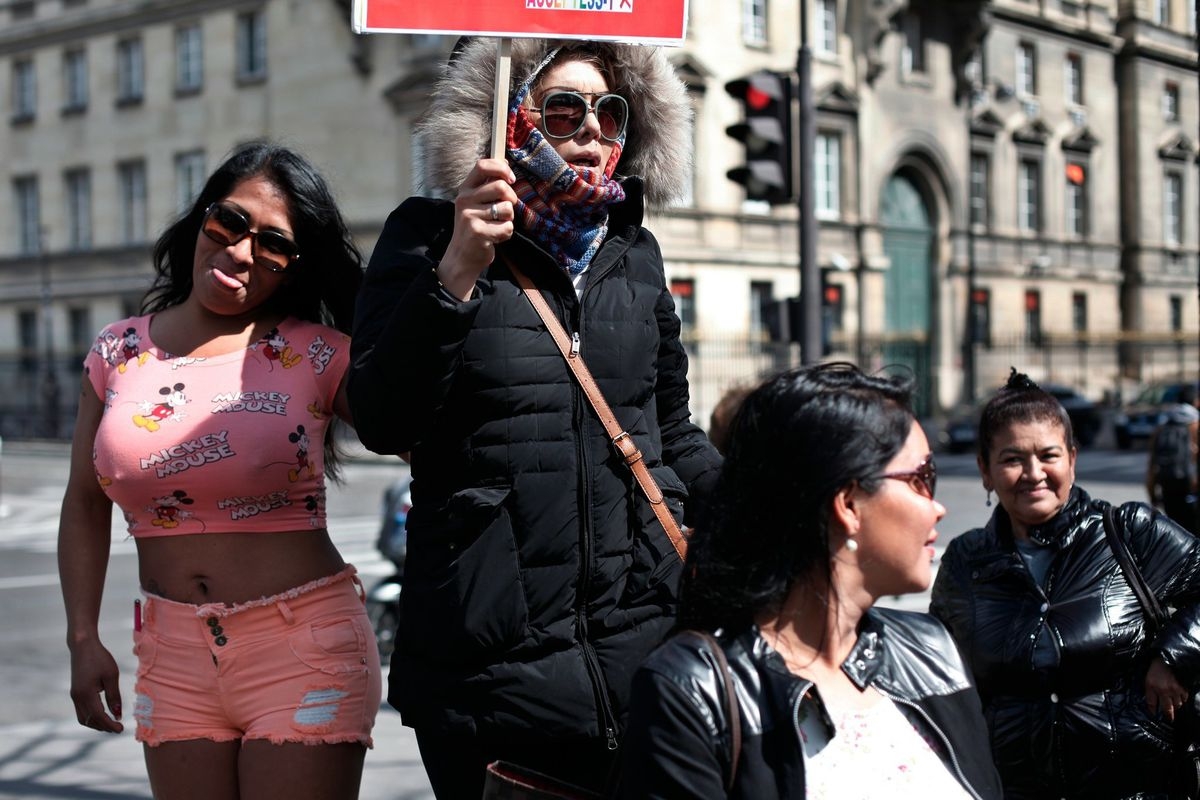 Sex workers hold signs during a protest against new bill against prostitution and sex trafficking, in Paris, Wednesday, April 6, 2016. (AP Photo/Thibault Camus) (The Associated Press)