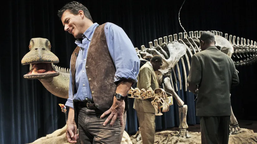 Paul Sereno, Ph.D., left, onstage with Nigerian archeologists Dr. Maga Abdoulaye, left, and Dr. Ide Oumarou, right, with the reconstructed skeleton of Nigersaurus. BILL O'LEARY/THE WASHINGTON POST/GETTY IMAGES