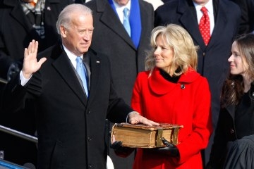 Joe Biden, left, is sworn in as Vice President as his wife Jill holds up a bible during the inauguration ceremony for him and President Barack Obama at the U.S. Capitol in Washington, Jan. 20, 2009.Dennis Brack / Bloomberg / Getty Images