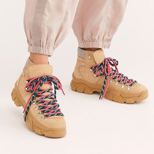 Woman wearing tan Another Project hiker boots