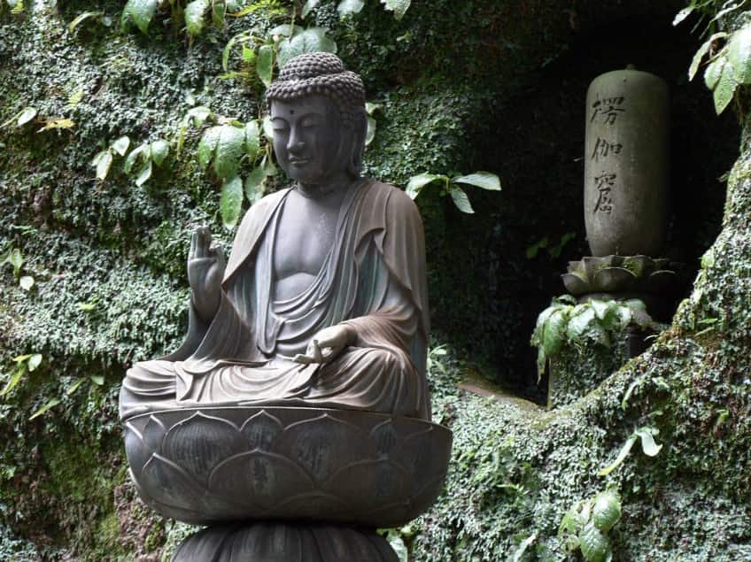 Japanese cemetery with a Buddha statue